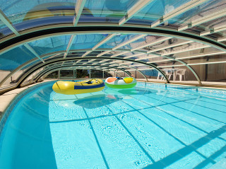 Pool covered with ELEGANT NEO built on wooden podium