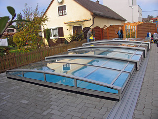 Retractable swimming pool cover VIVA fits great in your garden