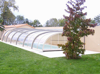 Pool enclosure STYLE over pool near by house