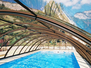 Swimming pool enclosure UNIVERSE keeps your pool cleaner