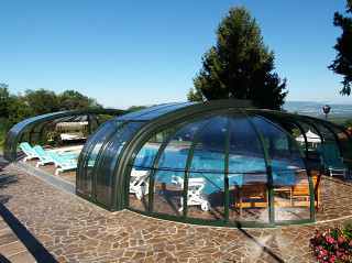 Retractable pool enclosure for public swimming pool