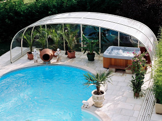 Inground pool cover LAGUNA NEO with an autumn garden