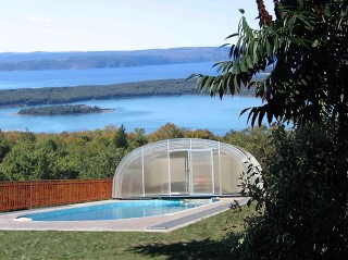 Fully retracted pool enclosure Laguna with beautiful view in the background