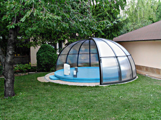 Pool enclosure ORIENT protects pool from debris