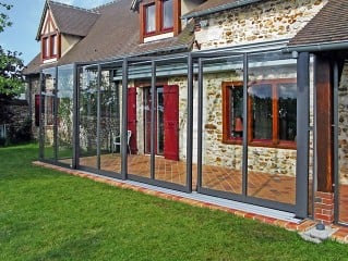 Retractable patio enclosure Corso Glass fits great to classic house