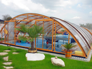 Swimming pool enclosure UNIVERSE with popular wood-like imitation on its construction