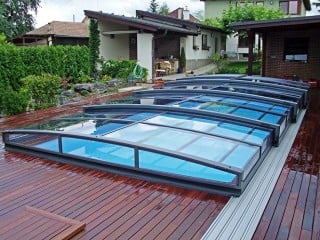 Anthracite color of pool enclosure Viva goes perfectly with wooden floor