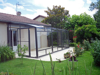 Innovative conservatory - retractable Patio enclosure CORSO by Alukov