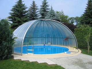 High oval pool enclosure ORIENT - in the corner of the garden
