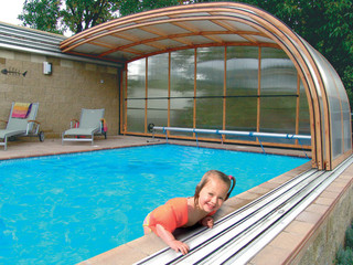 Pool enclosure STYLE is installed on nearby wall