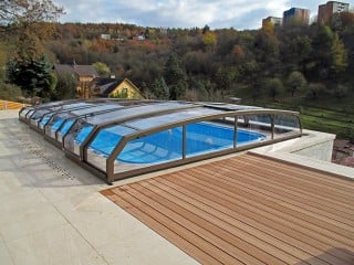 Swimming pool enclosure Riviera with bronze finish with beautiful view in the background