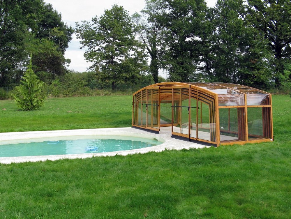 Photo gallery of Pool enclosure Vision retractable pool cover