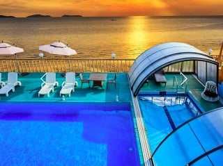 Beatiful view on pool enclosure Ravena with sunset