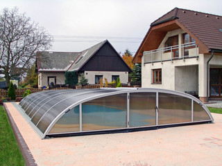 Retractable swimming pool enclosure ELEGANT with white profiles