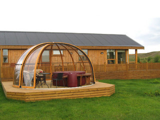 Pool enclosure ORIENT with woold-like finish used on its frames