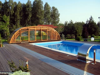 Retractable swimming pool enclosure TROPEA NEO in popular woodlike finish
