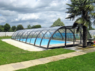 Swimming pool enclosure UNIVERSE can be opened on front side of the cover - popular anthracite color