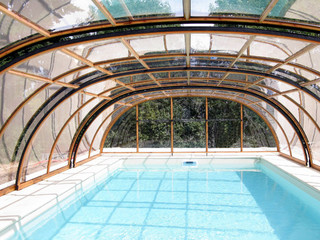 Pool enclosure UNIVERSE by Alukov - wood-like finish