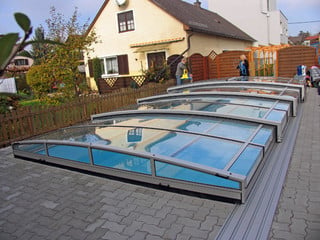 Retractable swimming pool cover VIVA fits great in your garden