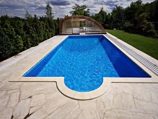 Retracted pool enclosure Ravena with wood imitation finish