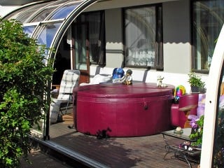 Look inside patio enclosure Corso ENTRY with hot tub