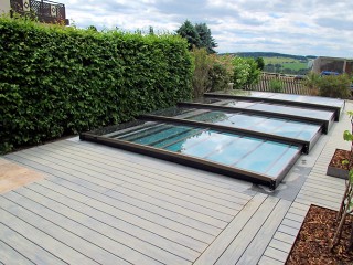 Low line swimming pool enclosure Terra on wooden deck