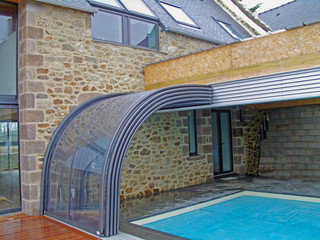 Retractable pool and patio enclosure CORSO Entry is an innovative house extension