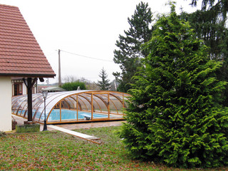 Pool enclosure UNIVERSE fits great over your pool - halfopened