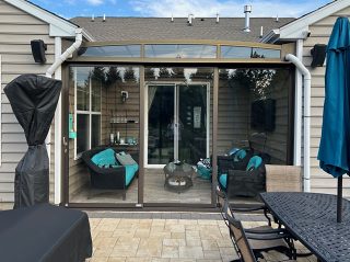 Comparison between conservatory and patio enclosure