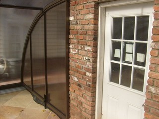 Custom made pool enclosure Tropea attached to a house
