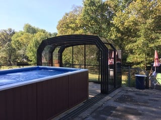 Fully opened pool enclosure Oceanic High over outdoor pool