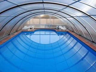 Inside the pool enclosure UNIVERSE - medium height pool cover