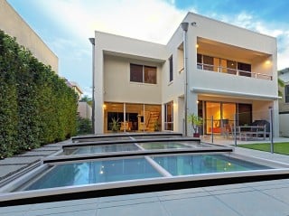 Lowest pool enclosure Terra with modern house in the background