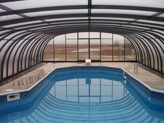 Newly installed pool enclosure Laguna from Pool and Spa Enclosures LLC.