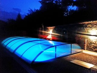 Opened pool enclosure Azure Flat at night