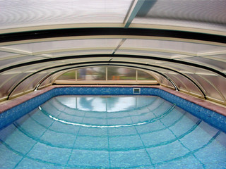 Swimming pool enclosure ELEGANT in the summer time