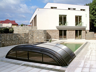 Inground pool enclosure ELEGANT with dark polycarbonate panels