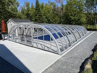 Relax poolside under the stylish Tropea pool enclosure