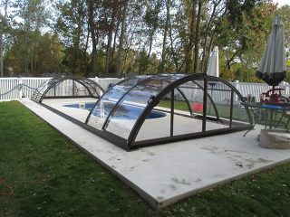 Swimming pool enclosure UNIVERSE with transparent polycarbonate panels