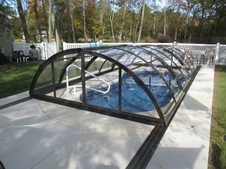 Swimming pool enclosure UNIVERSE with transparent polycarbonate panels